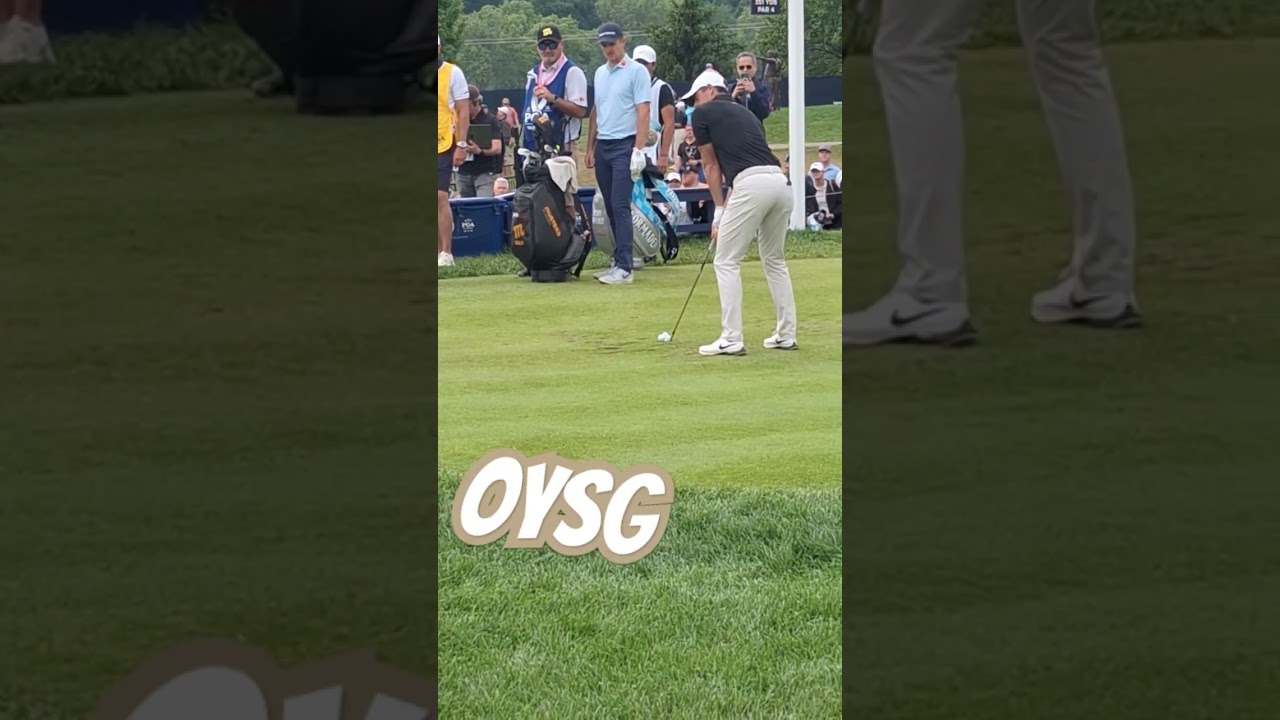 Rory McIlroy rips a 6-iron while Justin Rose looks on!  @FootJoy @OYSG