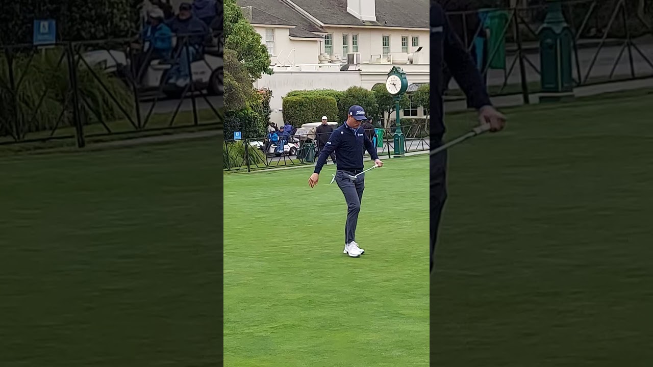 Justin Thomas getting in one last practice putt before teeing off in the 3rd round at Pebble Beach