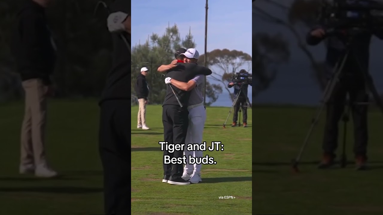 JT goes in for a hug when Tiger arrives on the range