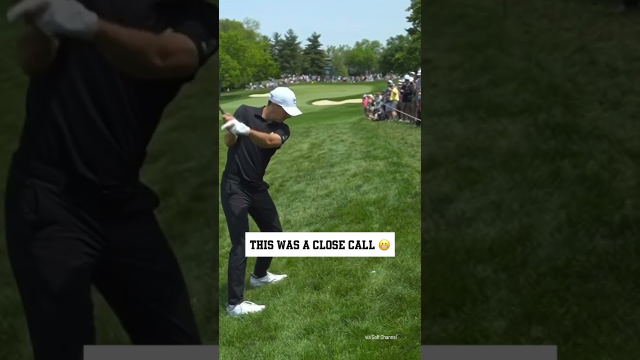 Jordan Spieth’s approach shot flies just overhead of the gallery.