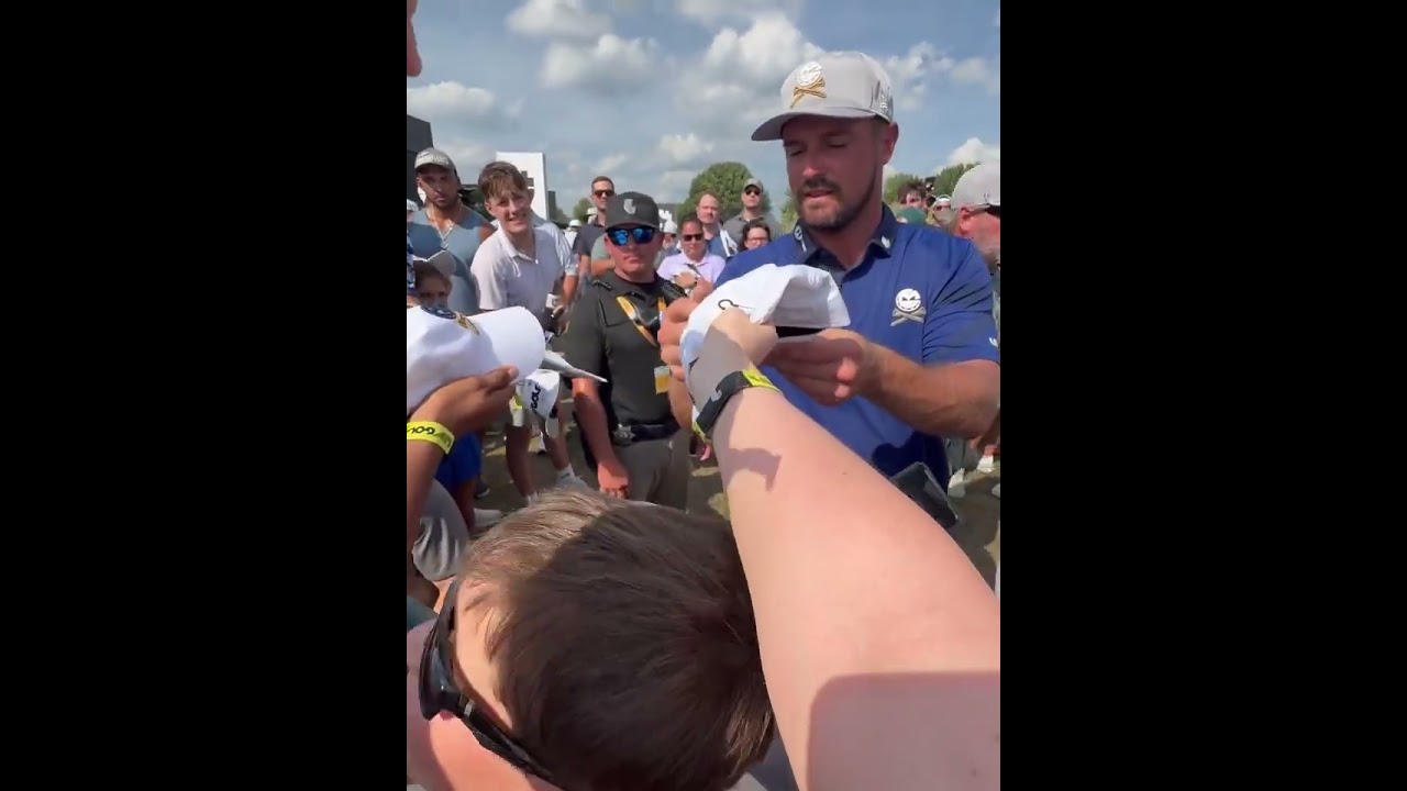 Bryson DeChambeau signing autographs in Chicago.