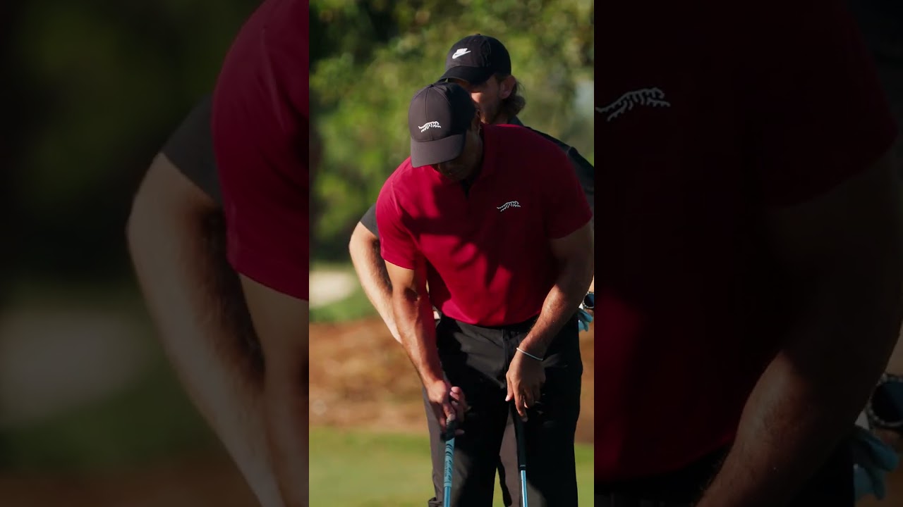 Tiger Woods with the most nonchalant 3-yard flop shot you'll ever see.